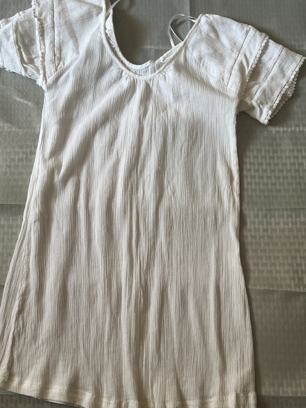 White vintage v-neck Tucic, size large with decorative pom pom on the sleeves